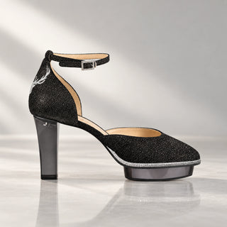 Schwarzer Glitzerpumps von CINDERELLA’S mit transparentem anthrazitfarbenem Blockabsatz, Plateau, Kristallschnalle und silberner Hirschstickerei.