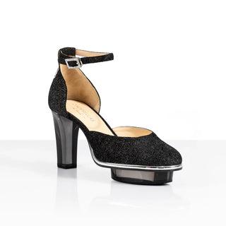 Exklusive Dirndlschuhe von der Firma Cinderella’s by Marcela in  schwarzen Wildleder mit drei Nüssen für Aschenputtel sowie hochwertigem transparentem schwarzen Absatz und Plateau. Die Schuhe sind mit silbernen Accessoires verziert, und die Ferse ist mit einer filigraner Hirschgeweihstickerei veredelt. Perfekt geeignet für Oktoberfest- oder gehobene Trachtenevents.
